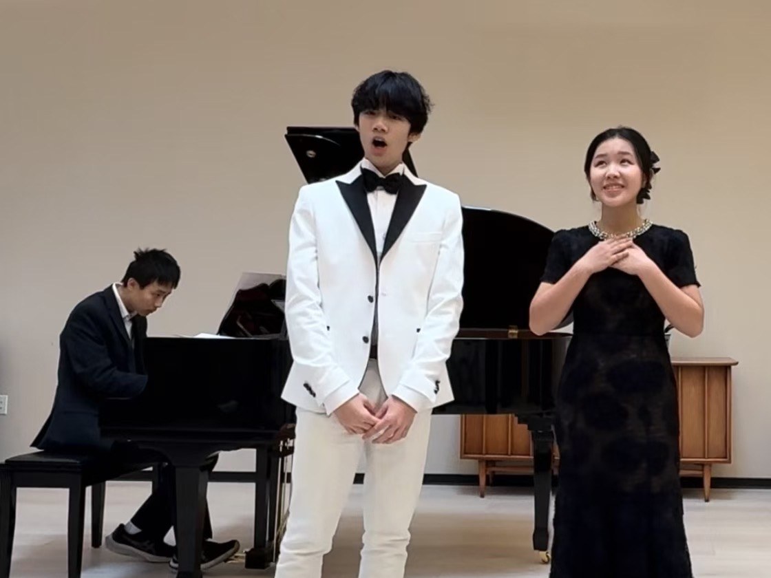 Young performers preparing for a benefit concert.