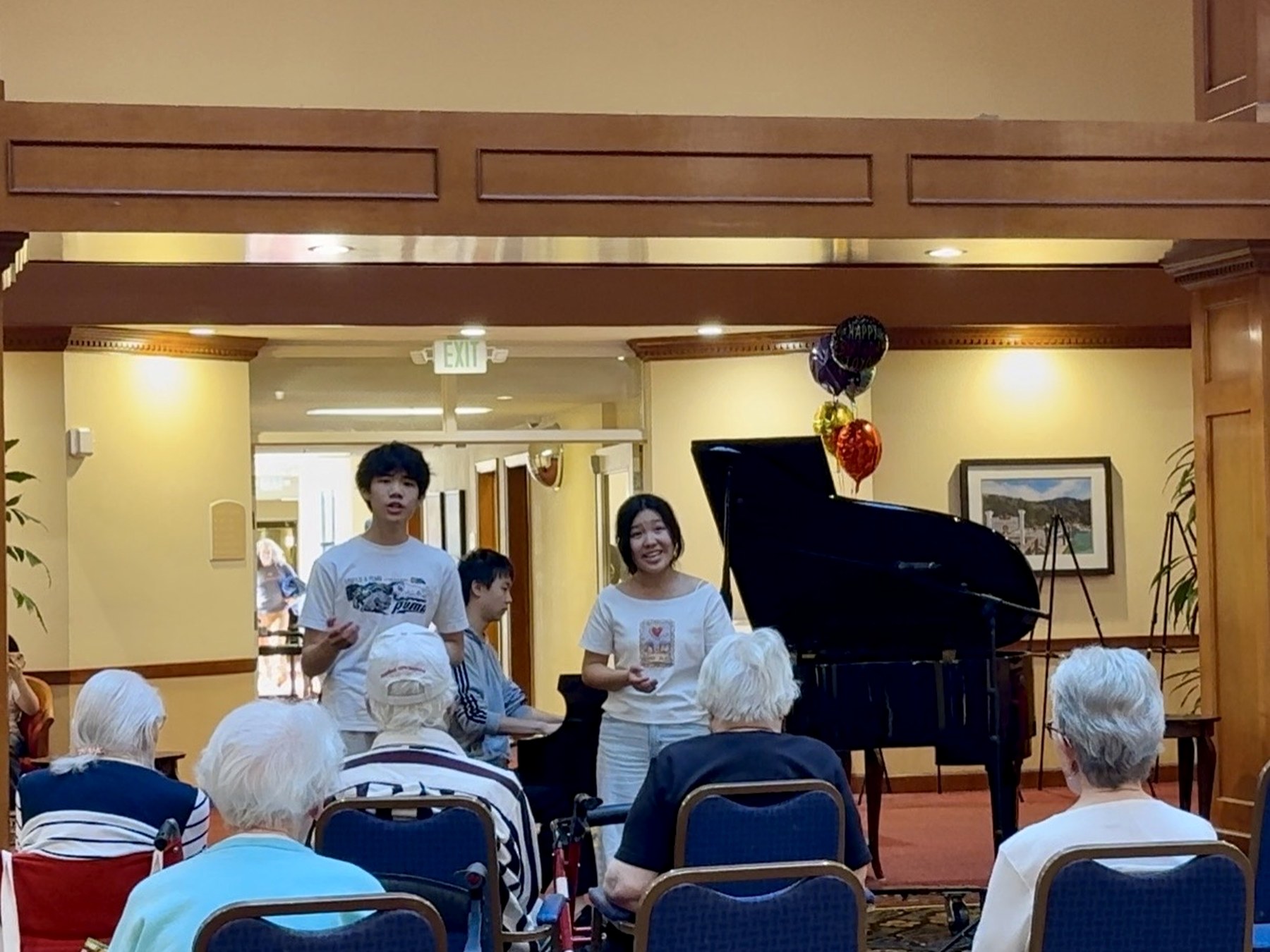 Students performing for senior community residents.
