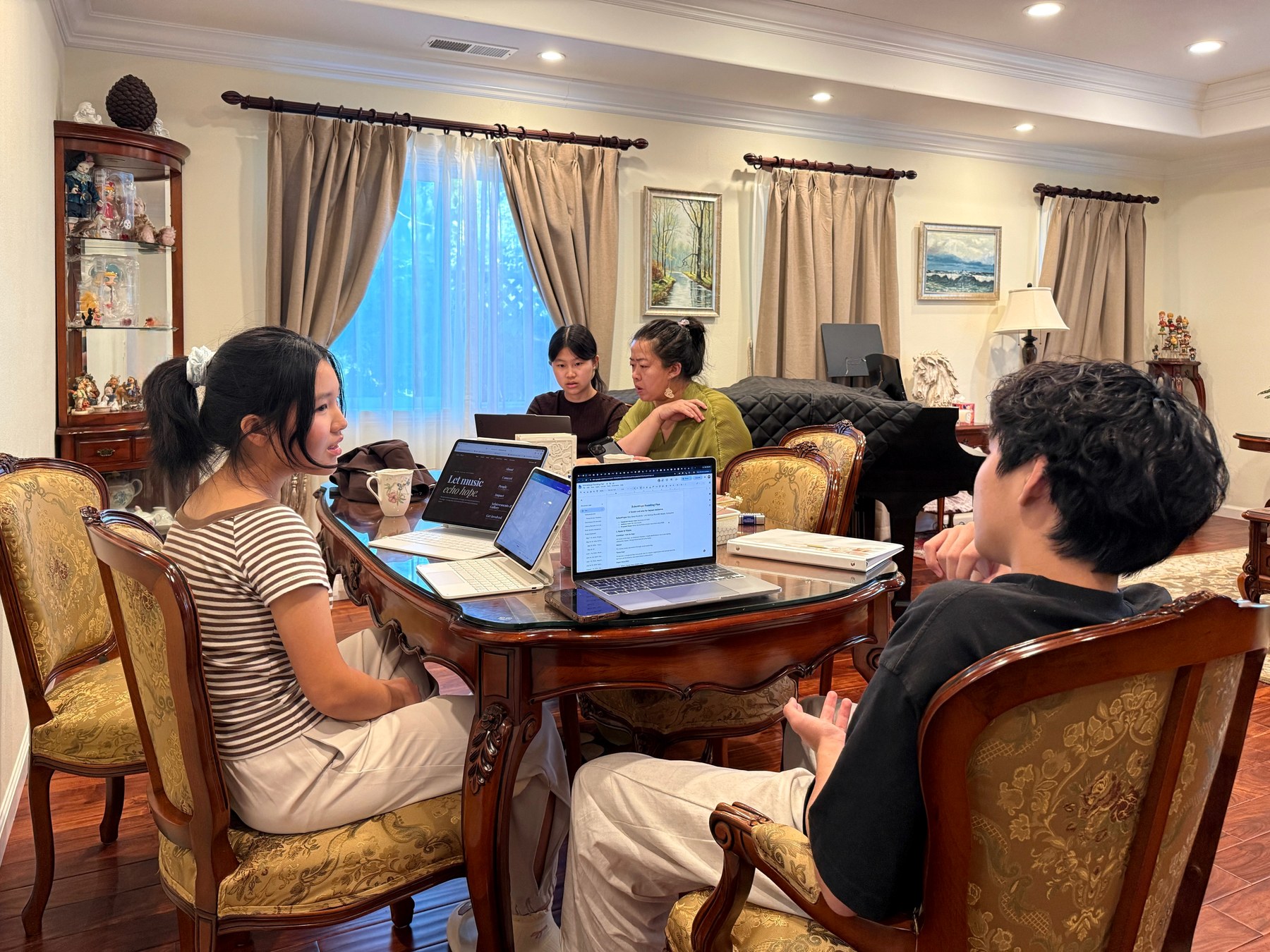 Students and advisors working through project planning materials during a meeting.