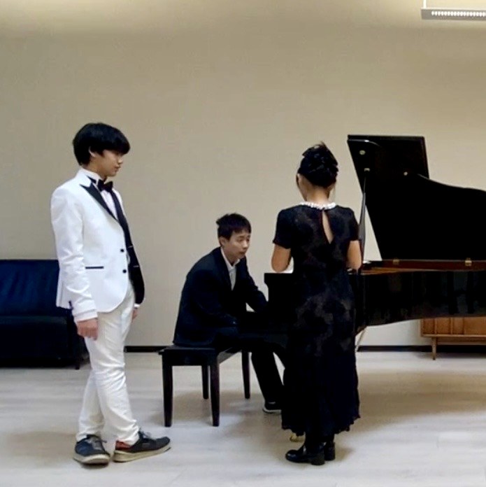 A student rehearsing at the piano.